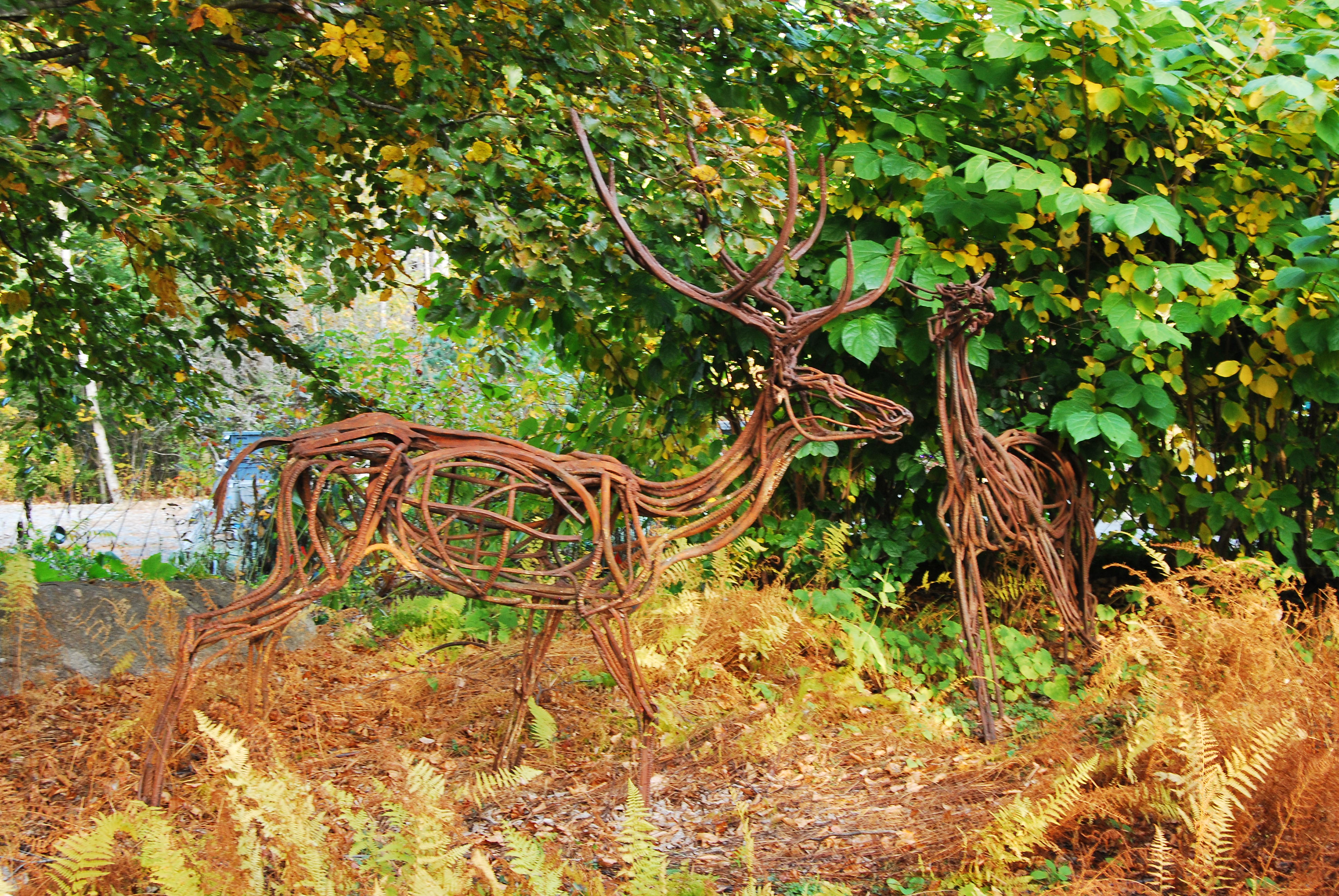 2 deer sculptures made out of metal pipes